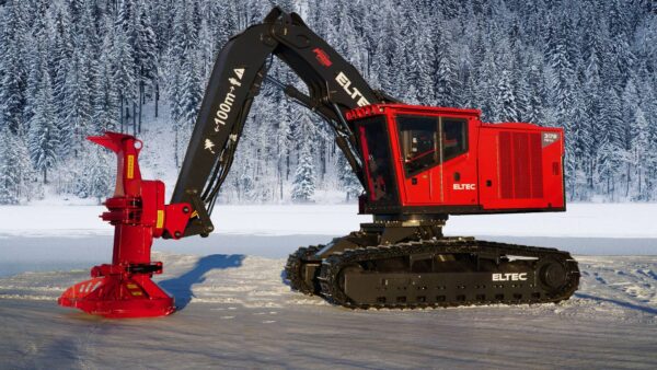 ELTEC FB317 feller buncher in a snowy forest with a Quadco head